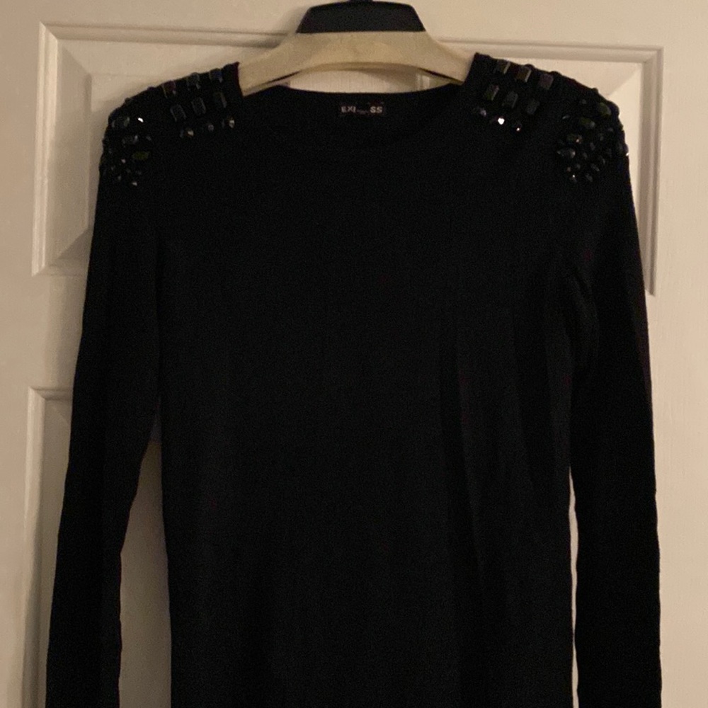 Express brand long black sweater with black jewel accents on shoulders.
